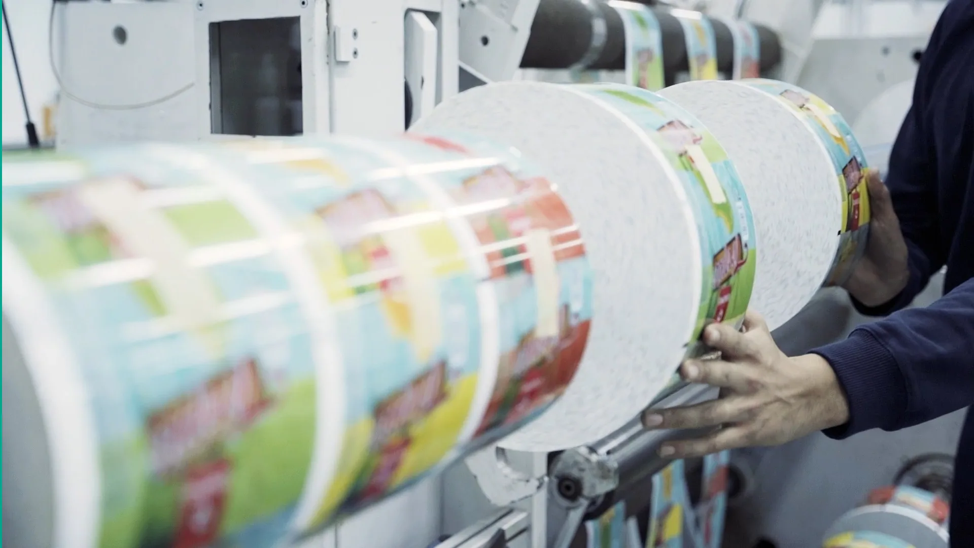 Slit reel of printed labels coming off the slitter — Altea Packaging