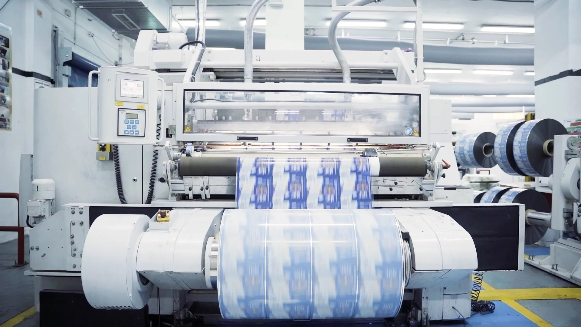 Slitter running, slit reels of printed film — Altea Packaging